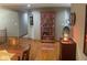 Cozy living room featuring hardwood floors, decorative shelving, and warm lighting at 1165 Tewksbury Ct, Mooresville, IN 46158