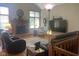 Cozy living room with brick fireplace, vaulted ceiling, and hardwood floors at 1165 Tewksbury Ct, Mooresville, IN 46158