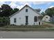 Charming two-story home featuring a classic design with a cozy front porch, ready for your personal touch at 121 School St, Greenfield, IN 46140