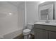 Well lit bathroom featuring a shower-tub, single sink vanity, and vinyl flooring at 12490 Morning Ridge Way, Noblesville, IN 46060