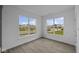 Cozy bedroom with plenty of natural light from the large windows, providing a bright and airy living space at 12490 Morning Ridge Way, Noblesville, IN 46060