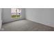 Bedroom with neutral carpet, and a large window with a view of the yard at 12490 Morning Ridge Way, Noblesville, IN 46060