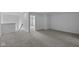 Large loft with neutral carpet, leading to the bedrooms and bathrooms at 12490 Morning Ridge Way, Noblesville, IN 46060
