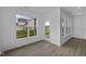 Bright sunroom with large windows, hardwood floors, and a door leading to the patio, creating a relaxing indoor-outdoor experience at 12490 Morning Ridge Way, Noblesville, IN 46060