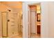 Bathroom with tiled floors, corner shower, and a view into another part of the bathroom at 1252 Jasmine Dr, Greenfield, IN 46140
