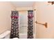 Bathroom with a floral shower curtain and a towel rack on the wall at 1252 Jasmine Dr, Greenfield, IN 46140