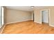 Spacious bedroom with hardwood floors and neutral walls, and a doorway leading to a closet at 1252 Jasmine Dr, Greenfield, IN 46140
