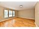 Bedroom showcasing hardwood floors, neutral walls, and three windows providing natural light at 1252 Jasmine Dr, Greenfield, IN 46140