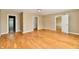 Bedroom showcasing wood floors with doorways leading to closet and other rooms at 1252 Jasmine Dr, Greenfield, IN 46140