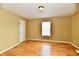 Bedroom featuring hardwood flooring and a window with natural light at 1252 Jasmine Dr, Greenfield, IN 46140