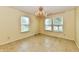Bright dining room featuring tile floors, three windows, and a stunning chandelier lighting fixture at 1252 Jasmine Dr, Greenfield, IN 46140