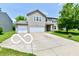 Inviting two-story home featuring a two-car garage and a spacious driveway at 1252 Jasmine Dr, Greenfield, IN 46140