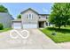 Beautiful two-story home with a two-car garage, green lawn, and inviting curb appeal at 1252 Jasmine Dr, Greenfield, IN 46140