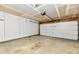 Spacious two-car garage with concrete floor and unfinished ceiling at 1252 Jasmine Dr, Greenfield, IN 46140
