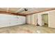 Spacious garage with white door, concrete floor, and fresh drywall, ready for your projects and parking needs at 1252 Jasmine Dr, Greenfield, IN 46140