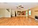 Spacious living room with wood floors and access to kitchen, bathroom, and upper levels at 1252 Jasmine Dr, Greenfield, IN 46140