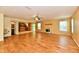 Open living room with tile flooring, ceiling fan, and views into the kitchen and bathroom at 1252 Jasmine Dr, Greenfield, IN 46140