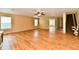 Bright living room with wood floors and a staircase, leading to upper-level living areas and bedrooms at 1252 Jasmine Dr, Greenfield, IN 46140