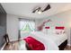 Bedroom with a ceiling fan, decorative accents, and a large window at 12535 Old Pond Rd, Noblesville, IN 46060