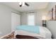 Bedroom with a ceiling fan, closet and window with natural light at 12535 Old Pond Rd, Noblesville, IN 46060