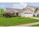 Charming single-story home with brick and siding, a well-maintained lawn, and an attached two-car garage at 12535 Old Pond Rd, Noblesville, IN 46060