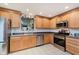 Spacious kitchen featuring wooden cabinets, stainless steel appliances, and a bright and functional layout at 12535 Old Pond Rd, Noblesville, IN 46060