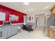 Eat-in kitchen with a bold red accent wall, stainless steel appliances, and breakfast nook at 12535 Old Pond Rd, Noblesville, IN 46060