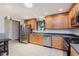 Bright kitchen featuring stainless steel appliances, light wood cabinets, and a skylight for natural light at 12535 Old Pond Rd, Noblesville, IN 46060