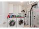 Functional laundry room equipped with modern washer and dryer, plus ample storage space at 12535 Old Pond Rd, Noblesville, IN 46060