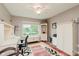 Cozy office space featuring a large window, desk, and storage, perfect for a home workspace at 12535 Old Pond Rd, Noblesville, IN 46060