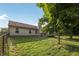 Spacious backyard with a charming tree swing, well-maintained lawn, and neutral colored home at 12848 Patrick Ct, Fishers, IN 46038