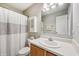 Bathroom with vanity, mirror, shower with white curtain, and built-in medicine cabinet at 12848 Patrick Ct, Fishers, IN 46038