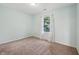 Bright bedroom with neutral carpet and a large window providing natural light at 12848 Patrick Ct, Fishers, IN 46038