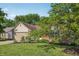Beautiful single-story home with a lush green lawn, brick accents, and an attached two-car garage at 12848 Patrick Ct, Fishers, IN 46038