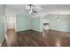 Inviting living room with hardwood floors, ceiling fan, and plenty of natural light at 12848 Patrick Ct, Fishers, IN 46038