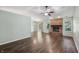 Spacious living room with hardwood floors, a brick fireplace, and sliding doors to the outside at 12848 Patrick Ct, Fishers, IN 46038
