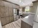 Modern kitchen features stainless steel appliances, wood cabinets, and granite countertops at 1359 Shadow Ridge Rd, Indianapolis, IN 46280