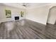 Spacious living room features hardwood floors and a stylish white fireplace at 1359 Shadow Ridge Rd, Indianapolis, IN 46280