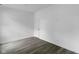An empty bedroom with gray flooring and white walls showcasing a minimalist, modern design at 1409 N Grant Ave, Indianapolis, IN 46201
