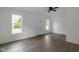 Bright living room boasts hardwood floors, a white front door, and is illuminated by natural light at 1409 N Grant Ave, Indianapolis, IN 46201