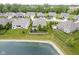 Well-manicured backyard on a lovely lot with mature trees in a beautiful neighborhood with water access at 16209 Natures Way, Westfield, IN 46074