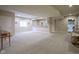 Spacious finished basement area with neutral walls and carpet and wet bar in the background at 16209 Natures Way, Westfield, IN 46074