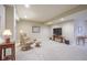 Spacious basement rec room with soft carpet, cozy seating, and warm lighting at 16209 Natures Way, Westfield, IN 46074