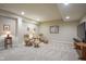 Finished basement featuring neutral walls and carpet with two sitting chairs and a television at 16209 Natures Way, Westfield, IN 46074