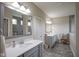 Bathroom with double sink vanity, tiled floor and walls, great lighting and open space at 16209 Natures Way, Westfield, IN 46074