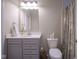 Well-lit bathroom featuring gray vanity with marble top, and neutral-toned shower curtain at 16209 Natures Way, Westfield, IN 46074