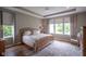 Comfortable bedroom features a tray ceiling, wood flooring, and great natural light at 16209 Natures Way, Westfield, IN 46074