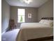 Cozy bedroom with plush carpeting, a comfortable bed, and a large window at 16209 Natures Way, Westfield, IN 46074
