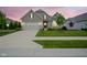 This home features a manicured lawn and inviting walkway leading to the front door at 16209 Natures Way, Westfield, IN 46074