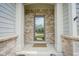 Inviting front entryway with brick columns and a welcoming 'Welcome' mat at 16209 Natures Way, Westfield, IN 46074